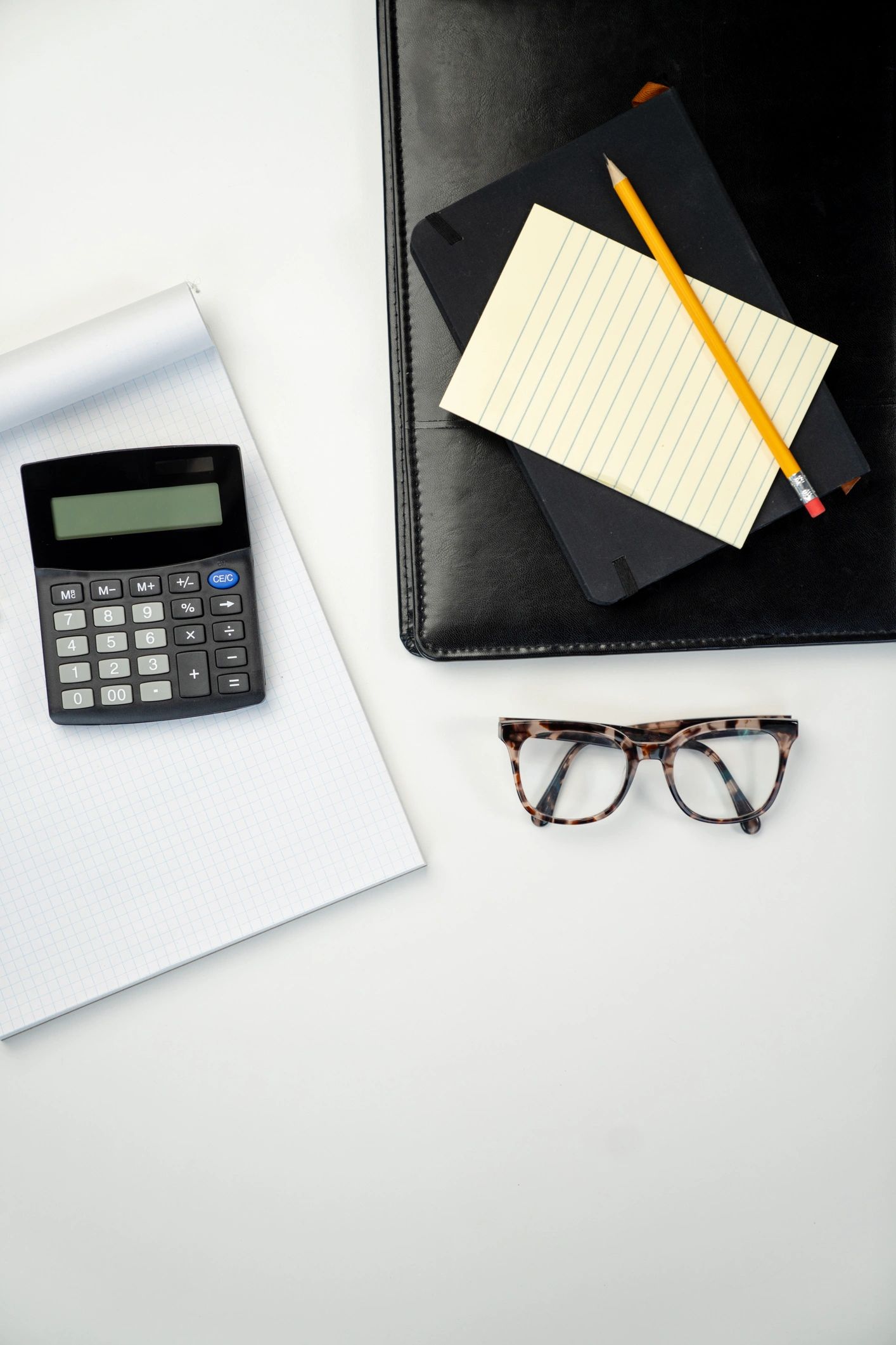 Calculator and financial paperwork for Canadian tax and accounting support