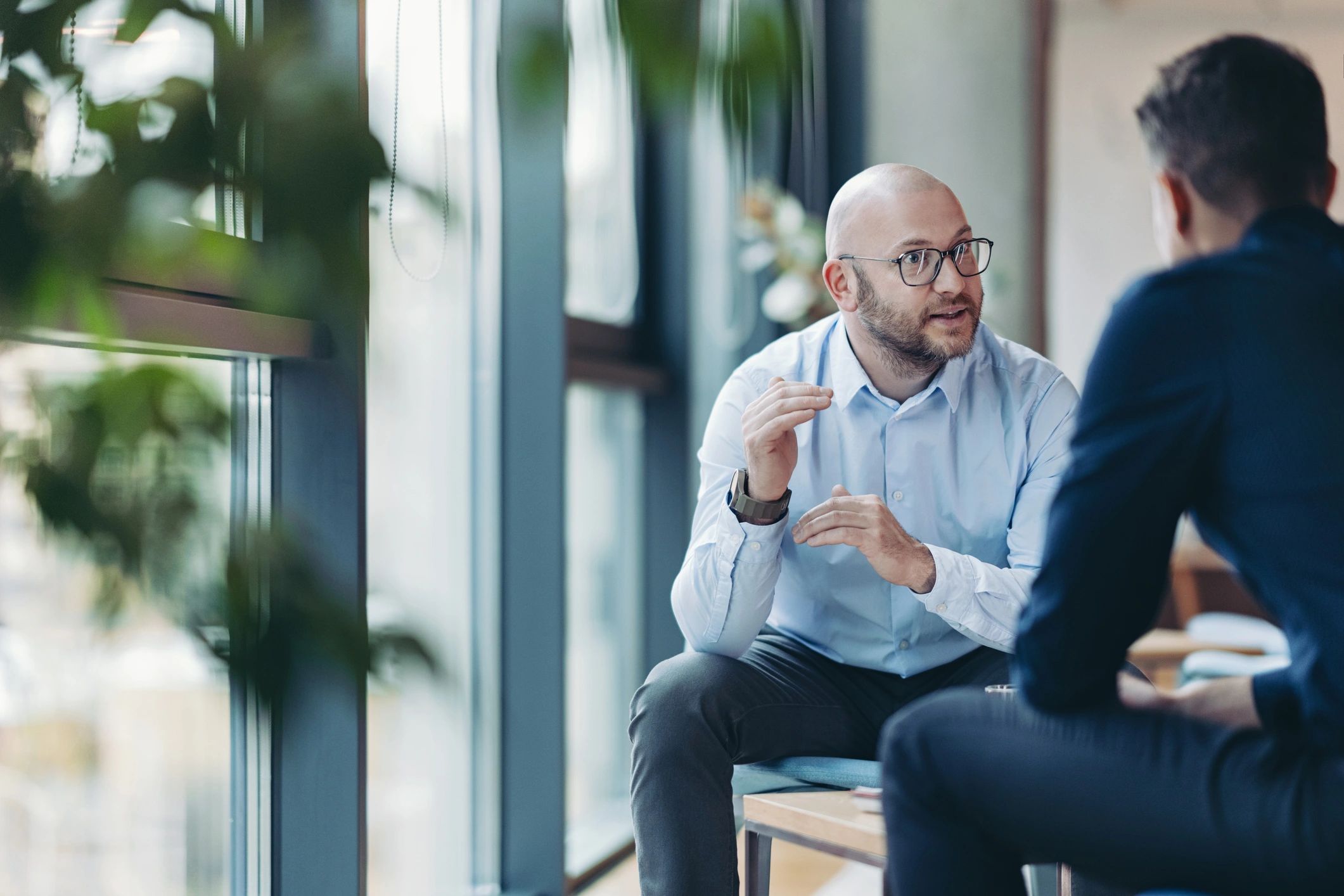 Business professionals discussing financial plans in an office